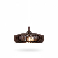 Lysverden dark wood ribbed dome pendant light with a warm glowing bulb in a Scandinavian Japandi style.