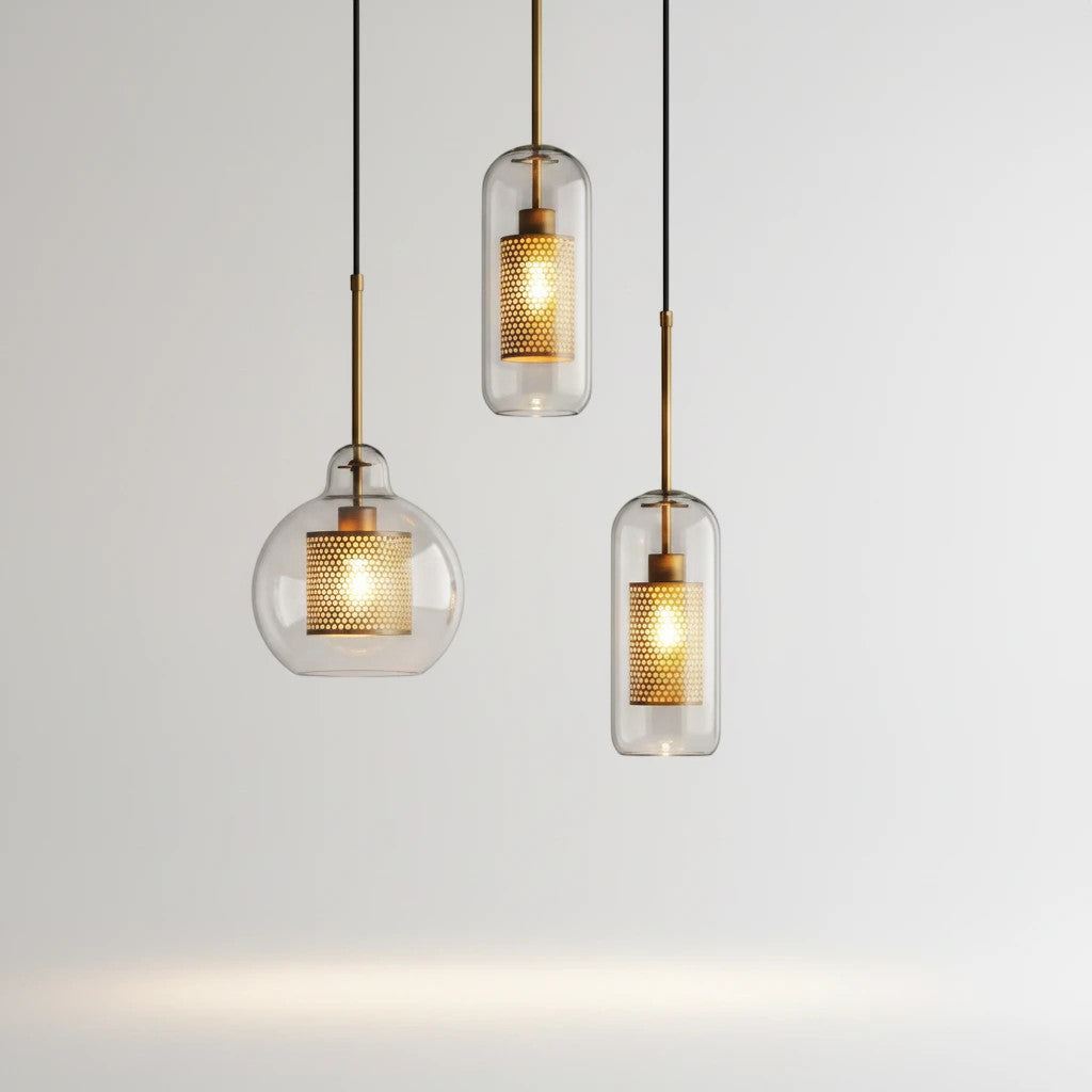 Lysverden glass pendant lights with clear glass shades and gold mesh inserts in a modern industrial style