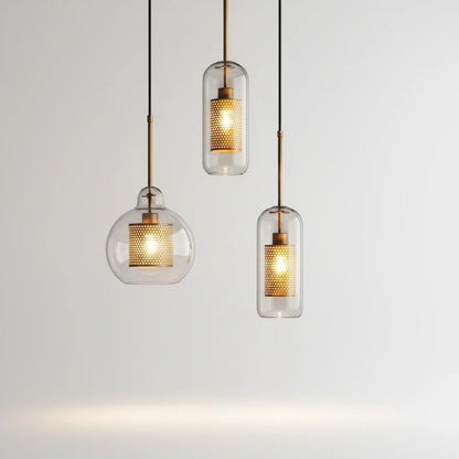 Lysverden glass pendant lights with clear glass shades and gold mesh inserts in a modern industrial style