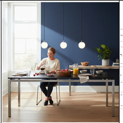Lysverden minimalist pendant lights with white glass globes and black cylinders hanging over a modern dining table.