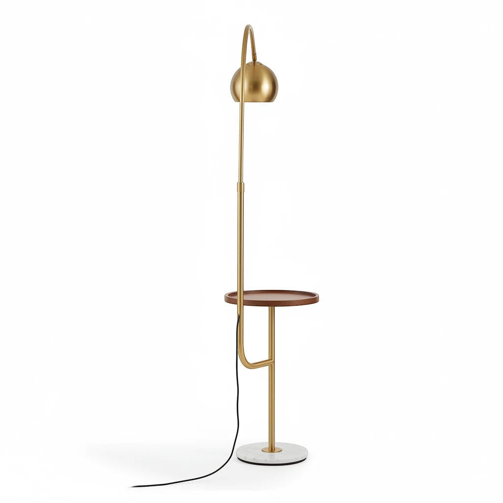 Lysverden arched floor lamp in gold metal with a round wooden side table and a solid white marble base.