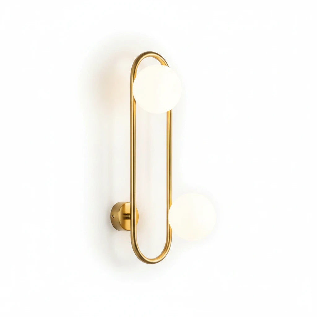 Lysverden midt-century wall lamp with a gold brass ring and two white glass globes for soft ambient lighting.