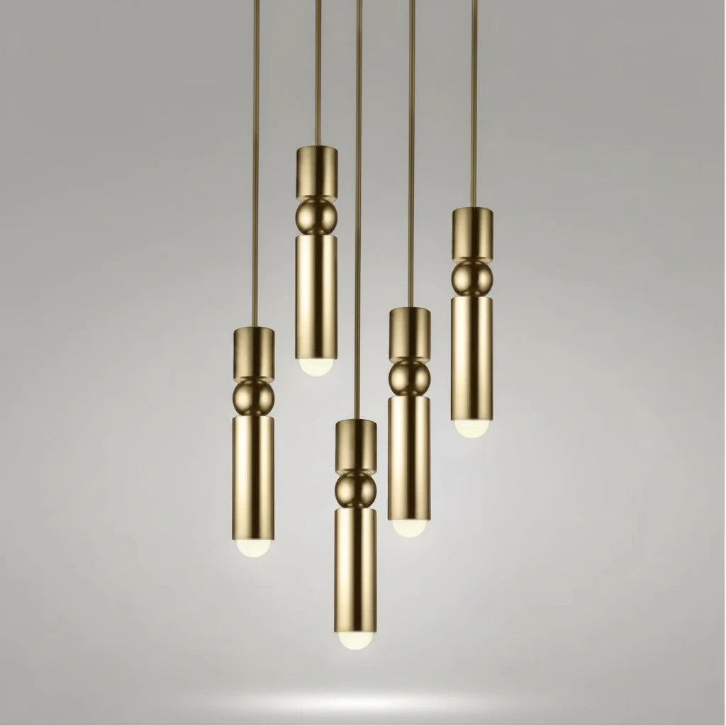 Lysverden gold cylinder pendant lights with sphere details hanging in a cluster for modern interior lighting
