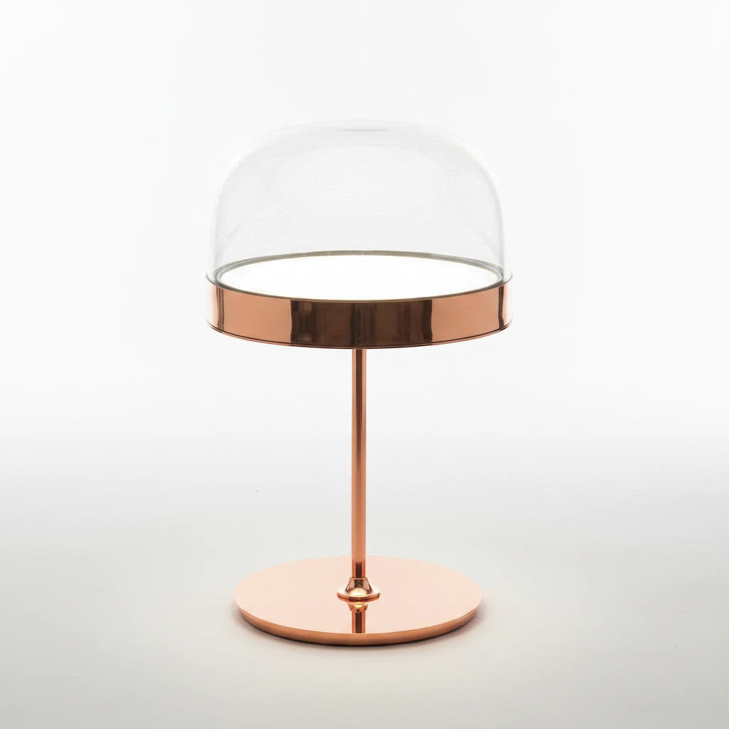 Lysverden elegant table lamp with a gold metallic base and a clear glass dome shade for modern interior lighting.