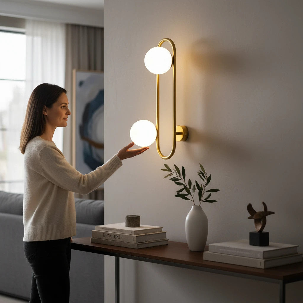 Lysverden midt-century wall lamp with gold ring and two white glass globes mounted on a living room wall