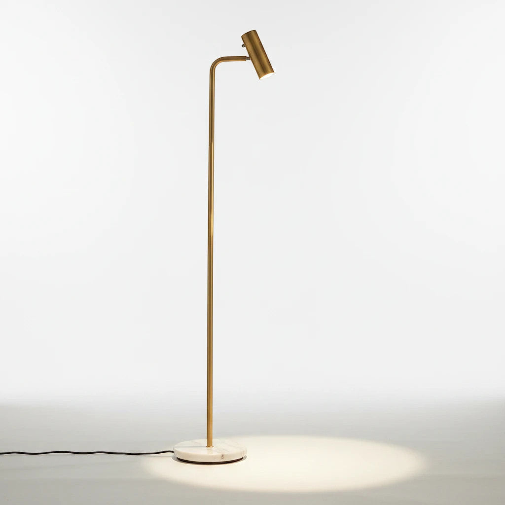 Lysverden gold floor reading lamp with a white marble base and adjustable LED head on a white background