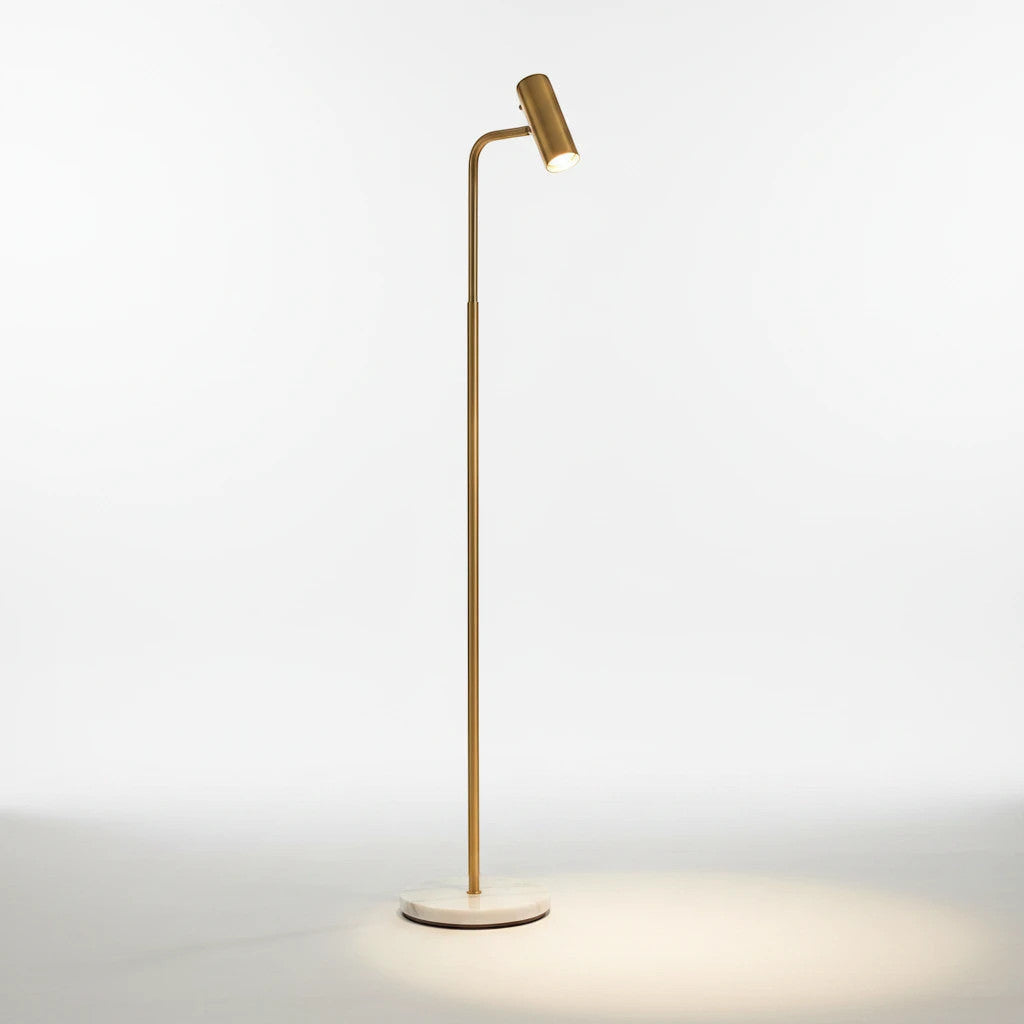 Lysverden minimalist gold floor reading lamp with a white marble base and adjustable LED head on a white background.