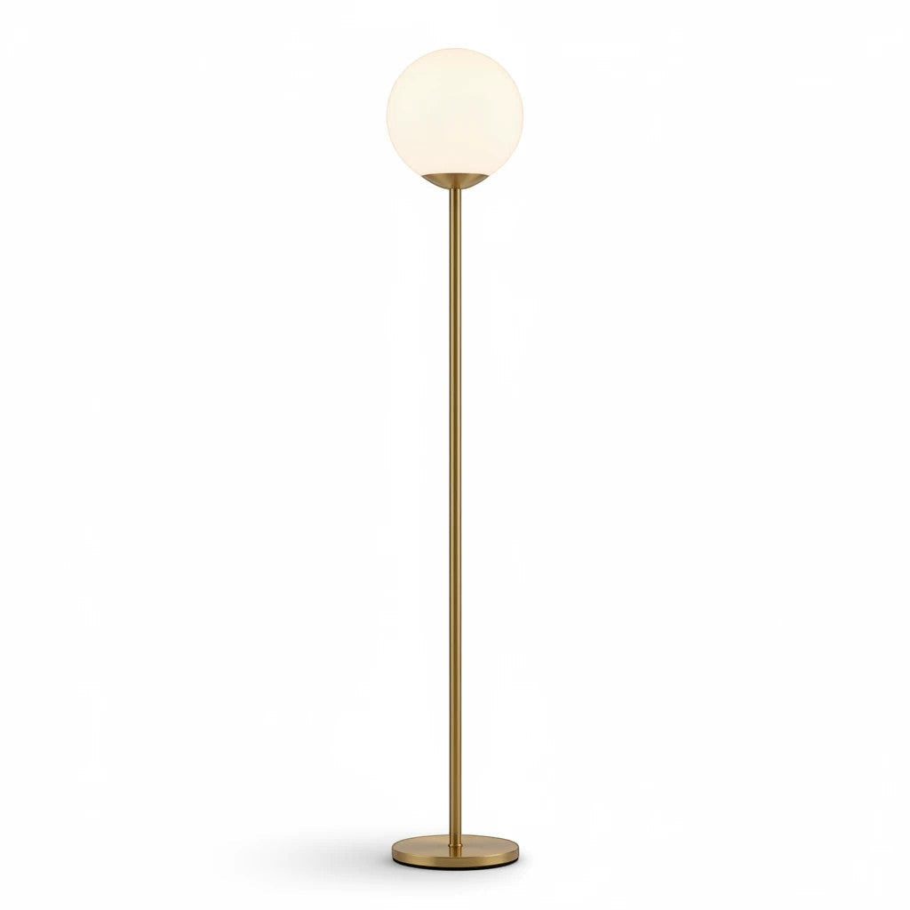 Lysverden minimalist floor lamp with a gold metal stand and a glowing opal glass sphere shade on a white background.