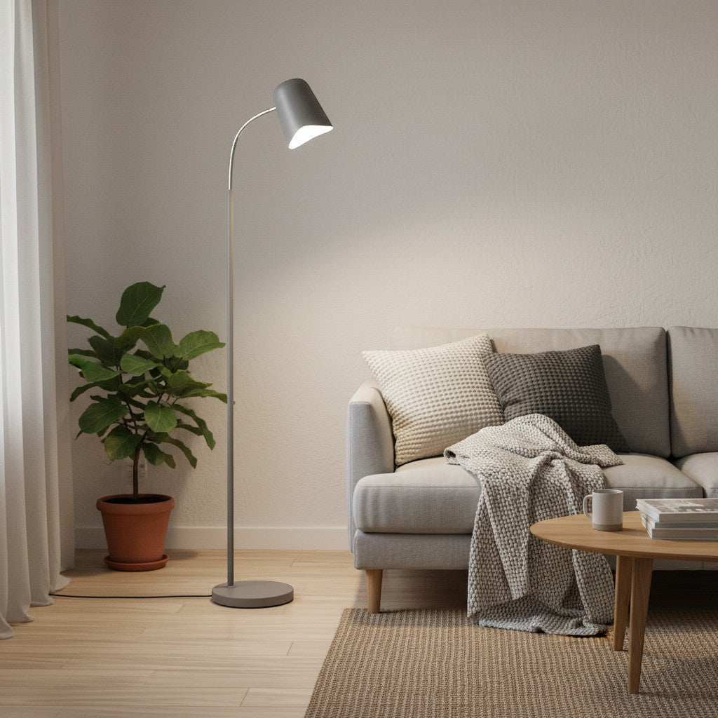 Lysverden minimalist grey metal floor lamp with adjustable cone shade in a cozy living room next to a sofa
