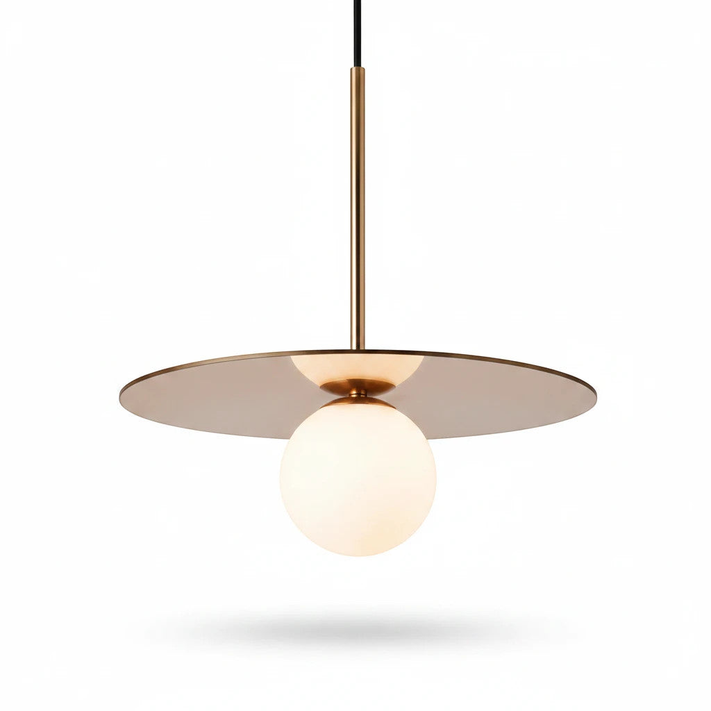 Lysverden Gulldisk pendant light with a brass disc and white opal glass sphere for soft, ambient lighting.