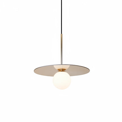 Lysverden Gulldisk pendant lamp featuring a gold disc and white opal glass sphere for soft, minimalist lighting.