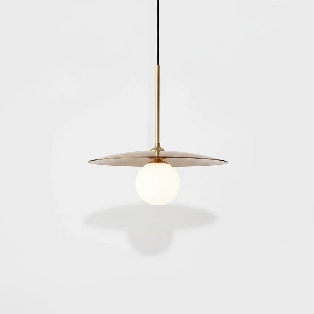 Lysverden Gulldisk pendant lamp with a minimalist gold metal disc and a white opal glass globe for soft lighting.