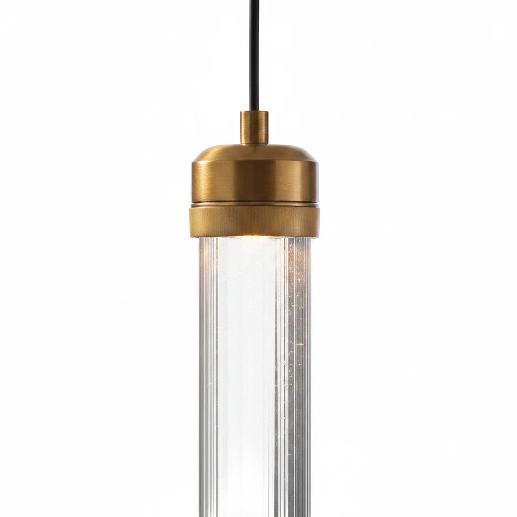Lysverden modern LED pendant light with a slim transparent acrylic tube and elegant gold metal detailing.
