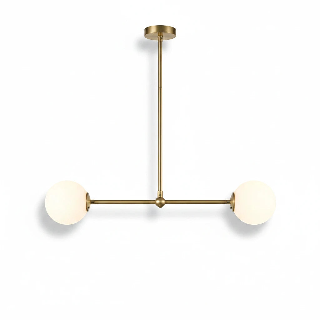 Lysverden linear pendant lamp with brass finish and two opal white glass globes in a mid-century modern style.