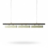 Lysverden linear pendant light featuring a black bar with brushed brass accents and three light modules.