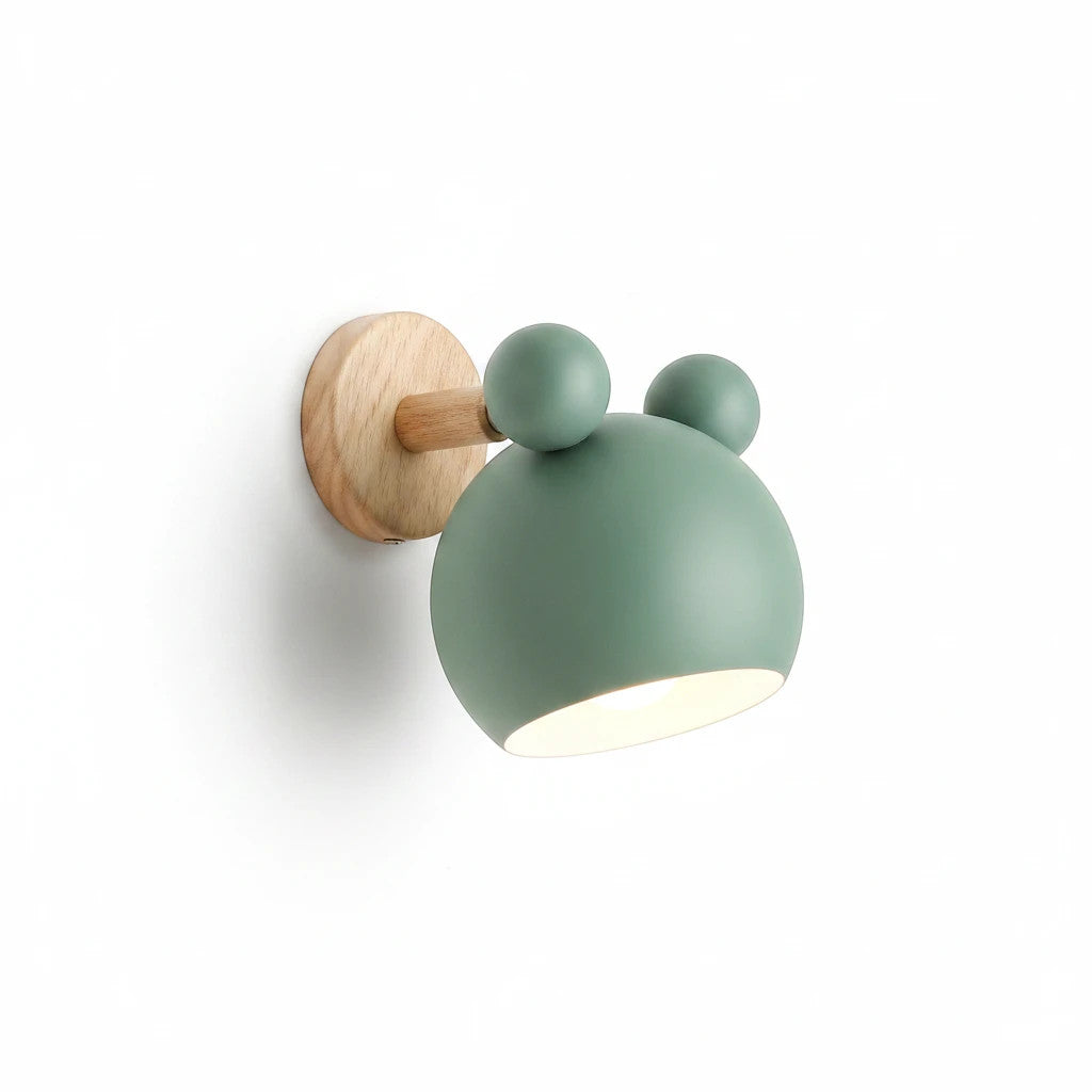 Lysverden Macaron wall lamp in sage green metal and light wood with an adjustable spotlight head for Nordic interiors.