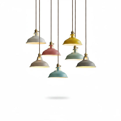 Lysverden Macaron pendant lights in various pastel colors with wooden details, hanging in a group against white.