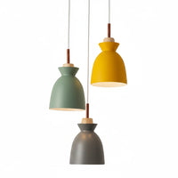 Lysverden macaron pendant lights in yellow, green, and grey metal with natural wood accents in a cluster arrangement.