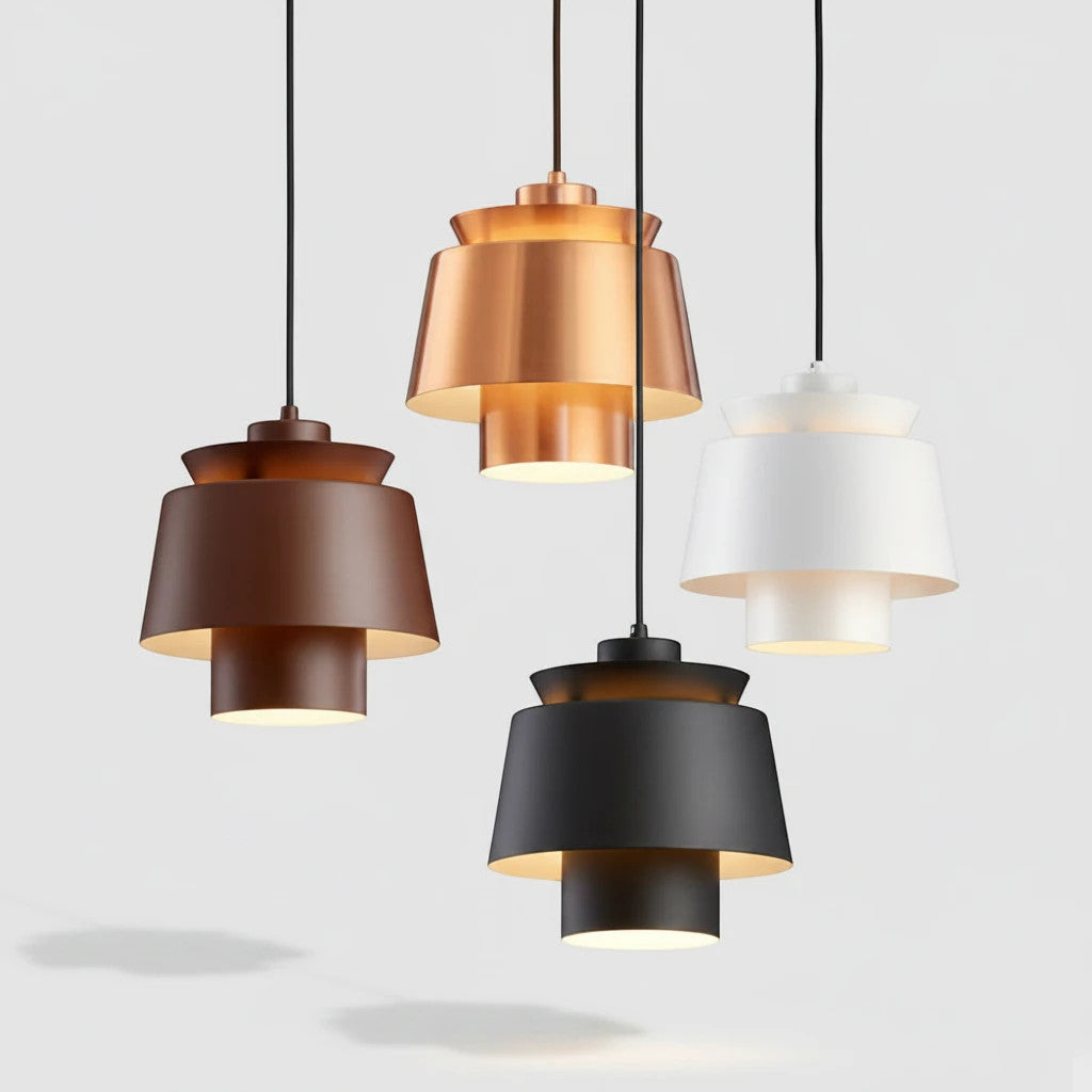 Lysverden metal pendant lights in black, white, gold, and brown with a modern Scandinavian tiered drum design.
