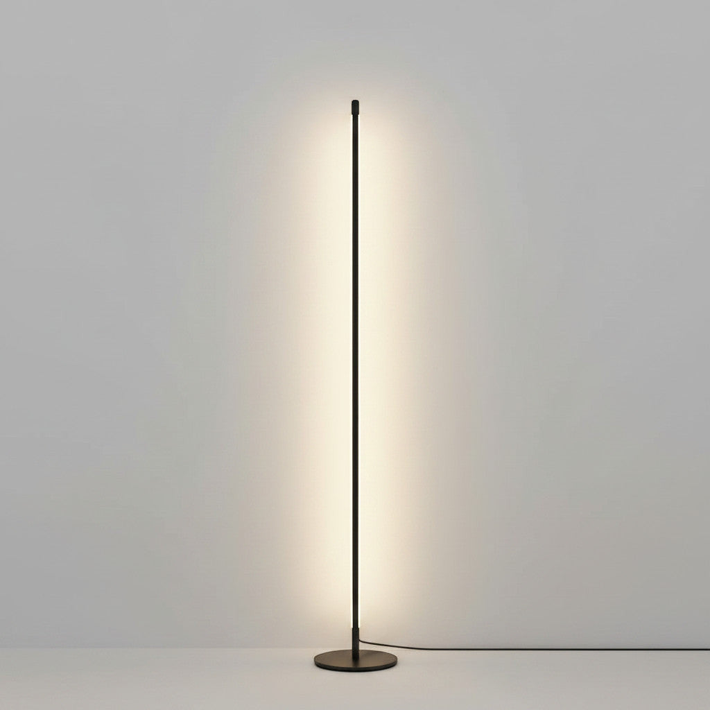 Lysverden minimalist black LED floor lamp with a slim, vertical design providing soft, indirect ambient lighting.