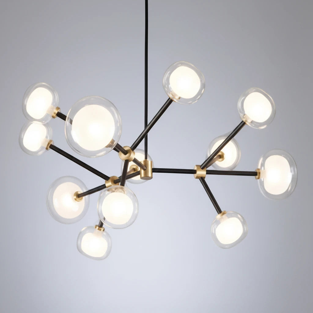 Lysverden Molekyl chandelier with black and gold metal arms and glowing opal glass spheres in a geometric design.