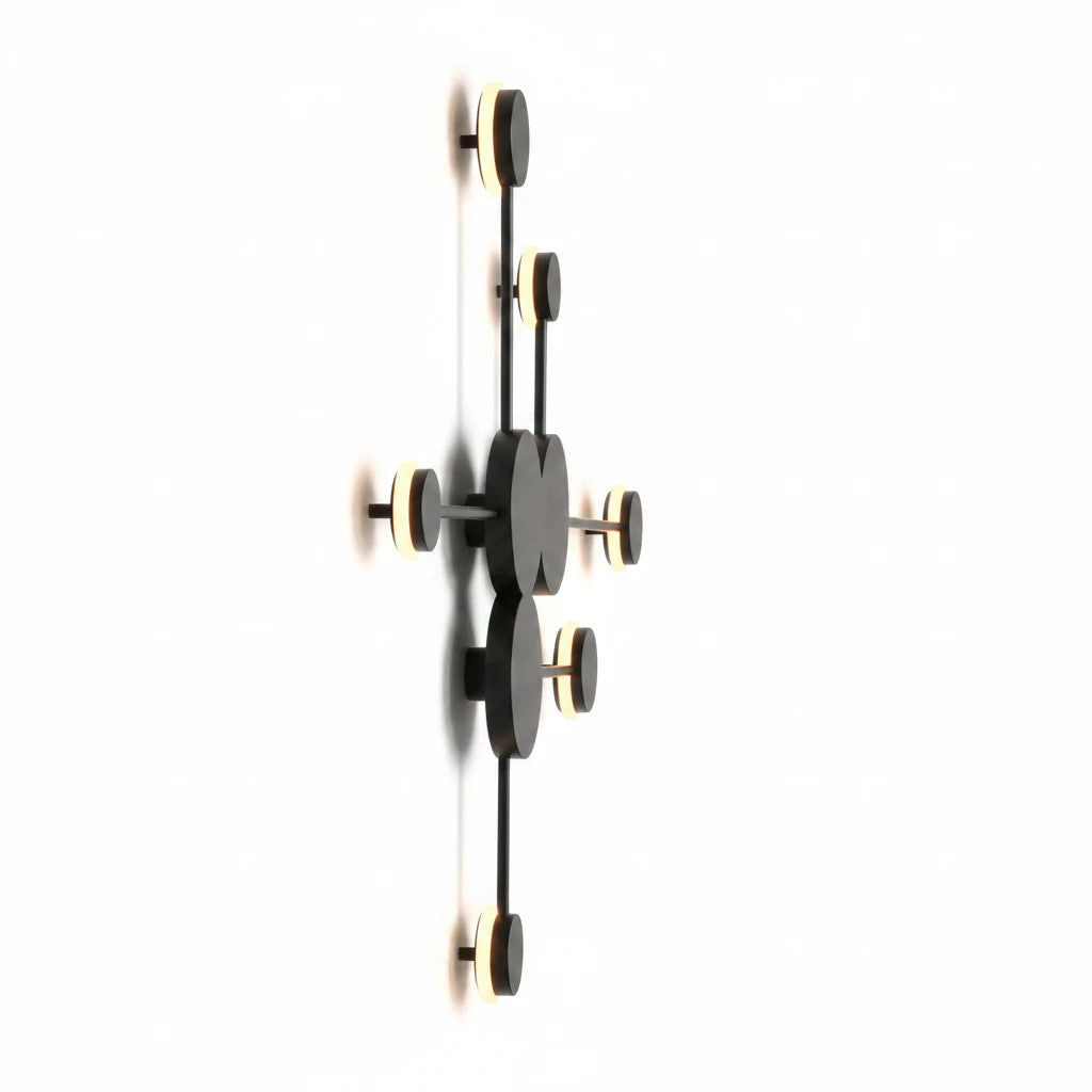 Lysverden Molekyl sputnik wall lamp in black and gold metal with integrated warm LED light points.