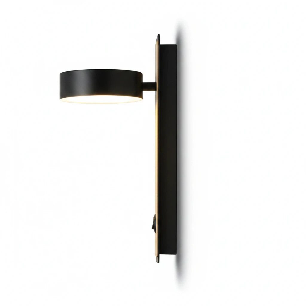 Lysverden Nordic wall lamp in black metal with a warm wood accent, featuring an adjustable head and integrated switch.