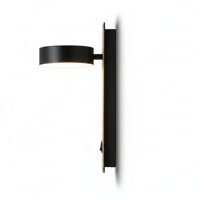 Lysverden Nordic wall lamp in black metal with a warm wood accent, featuring an adjustable head and integrated switch.