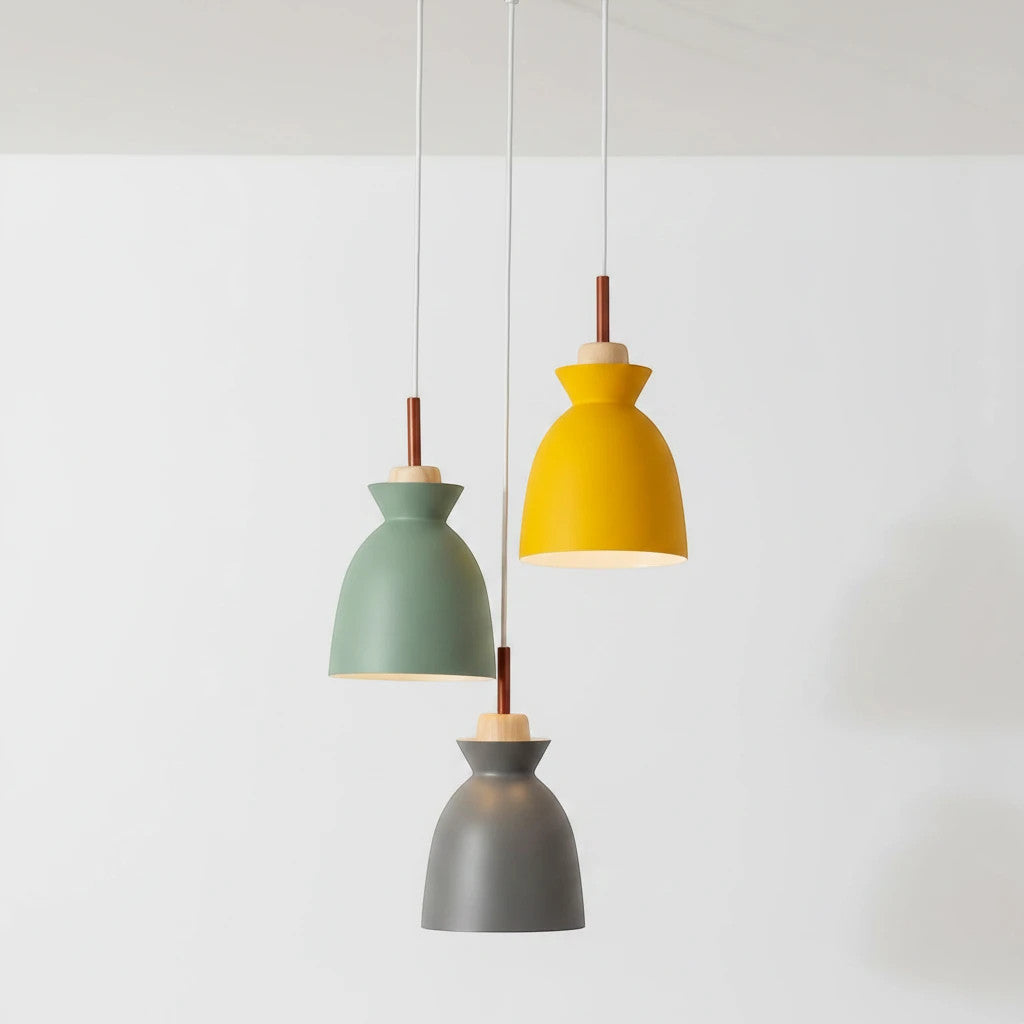 Lysverden Nordic cone pendant lights in yellow, green, and grey metal with natural wood accents hanging in a cluster.
