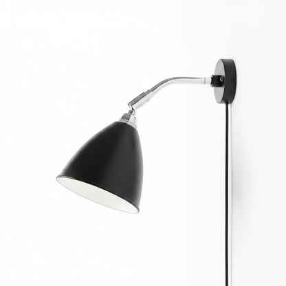 Lysverden Nordisk adjustable black wall lamp with a flexible chrome arm and conical shade for focused reading light.