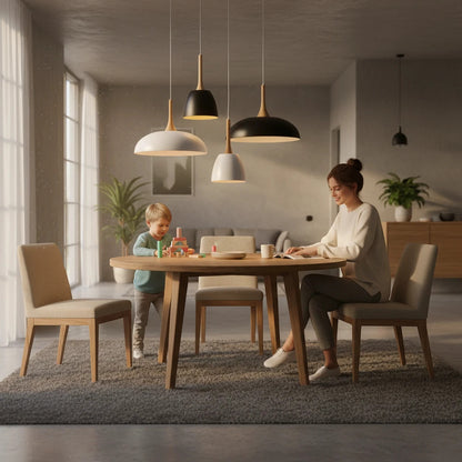 Lysverden Nordisk pendant lights with metal domes and wood accents hanging over a dining table in a modern home.