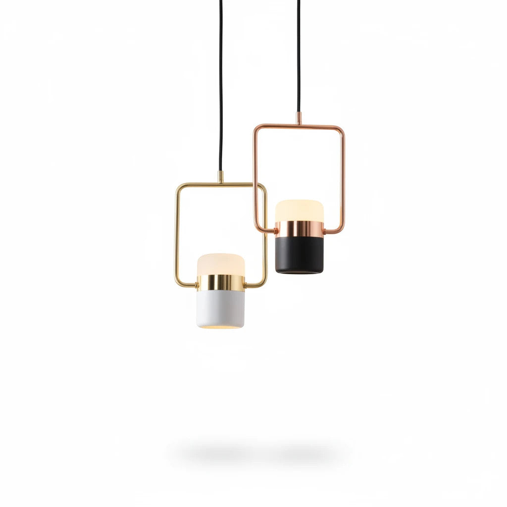 Lysverden minimalistiske pendellamper med sylindre i opalglass i sort og hvit, innrammet i elegant messing og metall.