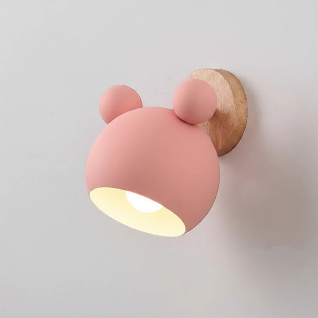 Lysverden pink bear-shaped wall lamp with a wooden base and warm LED light for a cozy nursery or child's bedroom.