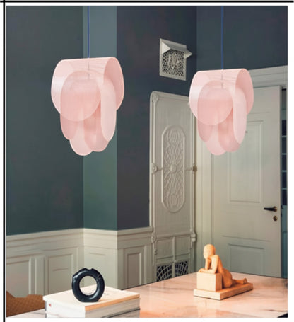 Lysverden pastel pink metal flower pendant lamps with layered petal design hanging in a modern living room