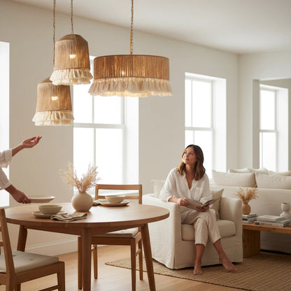 Lysverden boho rattan pendant lights with fringe details hanging over a dining table in a bright living room