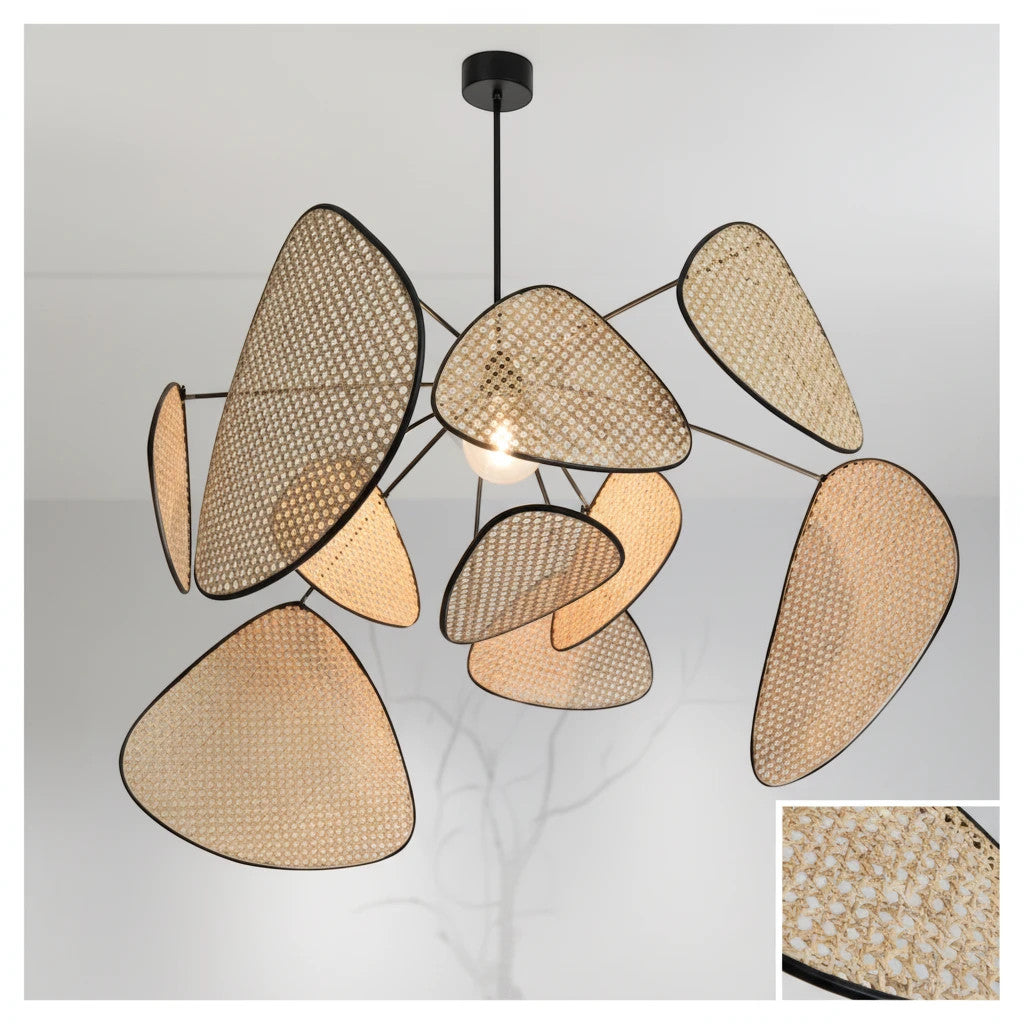 Lysverden sculptural pendant light featuring woven rattan leaves and a black metal frame for a modern boho aesthetic.