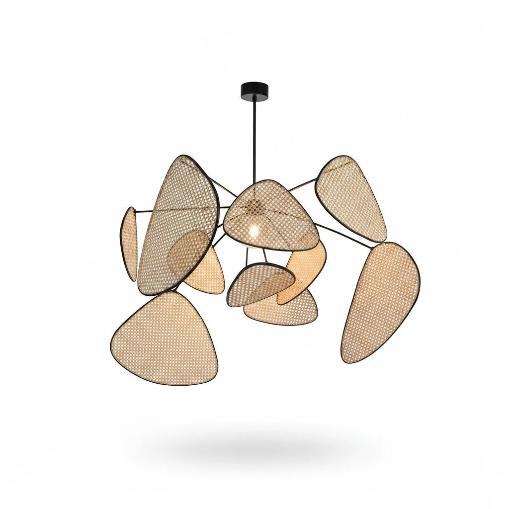 Lysverden sculptural pendant light with woven rattan leaves and a black metal frame for a modern boho aesthetic.