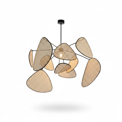 Lysverden sculptural pendant light with woven rattan leaves and a black metal frame for a modern boho aesthetic.