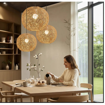 Lysverden round rattan pendant lights hanging in a cluster over a wooden dining table in a bright modern home