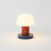 Lysverden retro mushroom table lamp with white opal shade, terracotta stem, and navy base. Rechargeable, dimmable, touch control.