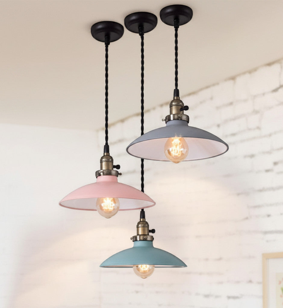 Lysverden retro pendant lights with flat pastel metal shades and Edison bulbs hanging in a cluster