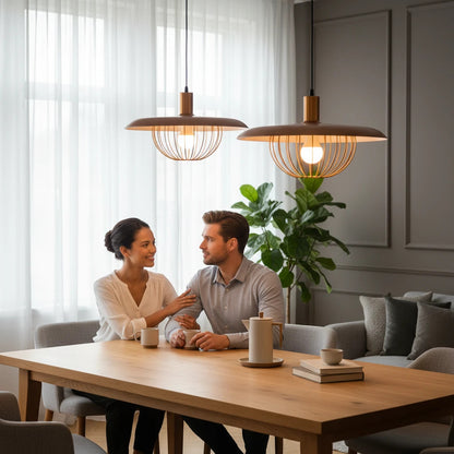 Lysverden metal pendant lamps with ribbed shades hanging over a dining table where a couple sits in a modern home.