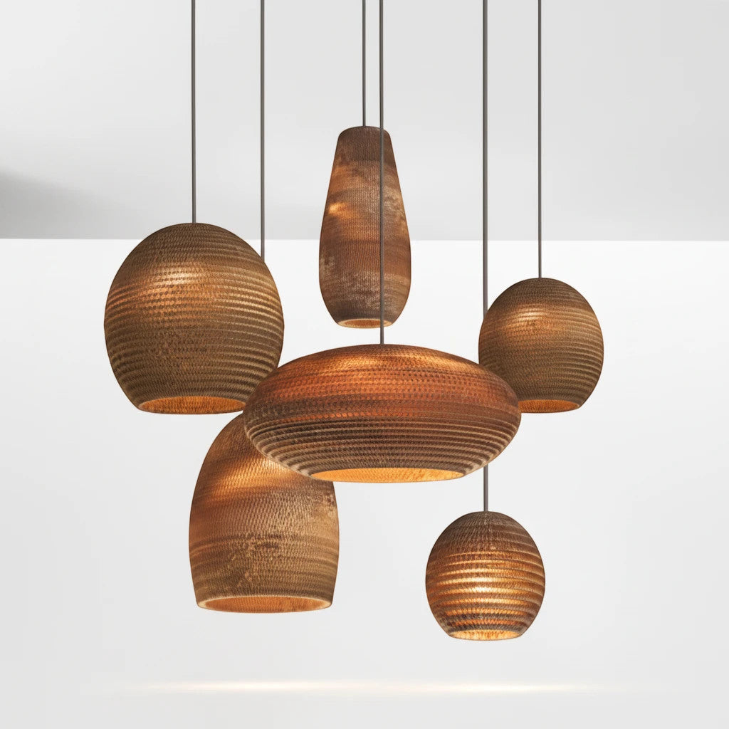 Lysverden cluster of ribbed wooden pendant lamps in honey tones with organic shapes for warm Scandinavian lighting.