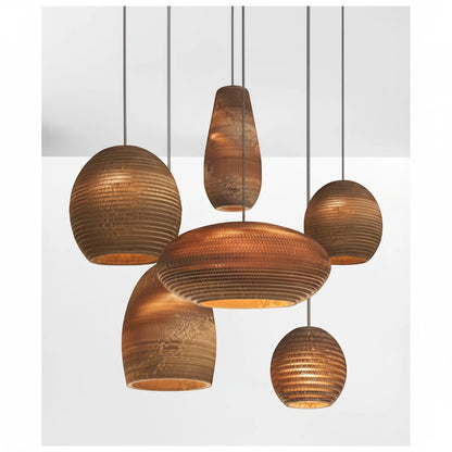 Lysverden ribbed wooden pendant lights in various organic shapes and honey tones, creating a warm, cozy atmosphere.