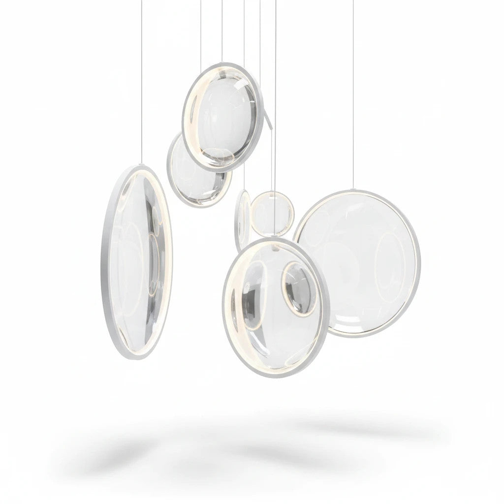 Lysverden ring-shaped LED pendant lights in white metal and acrylic, arranged in a modern sculptural cluster.