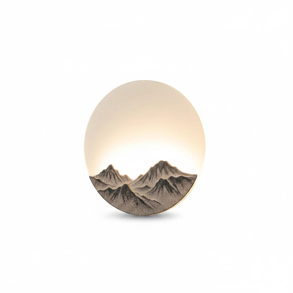 Lysverden round wall lamp with 3D mountain relief and warm LED moonlight effect in a Japandi style design.