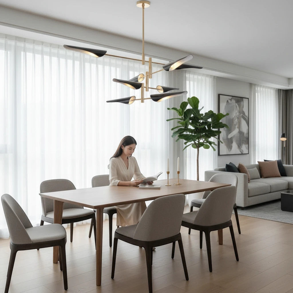 Lysverden sculptural chandelier with black cone shades and gold arms hanging over a dining table in a modern living room