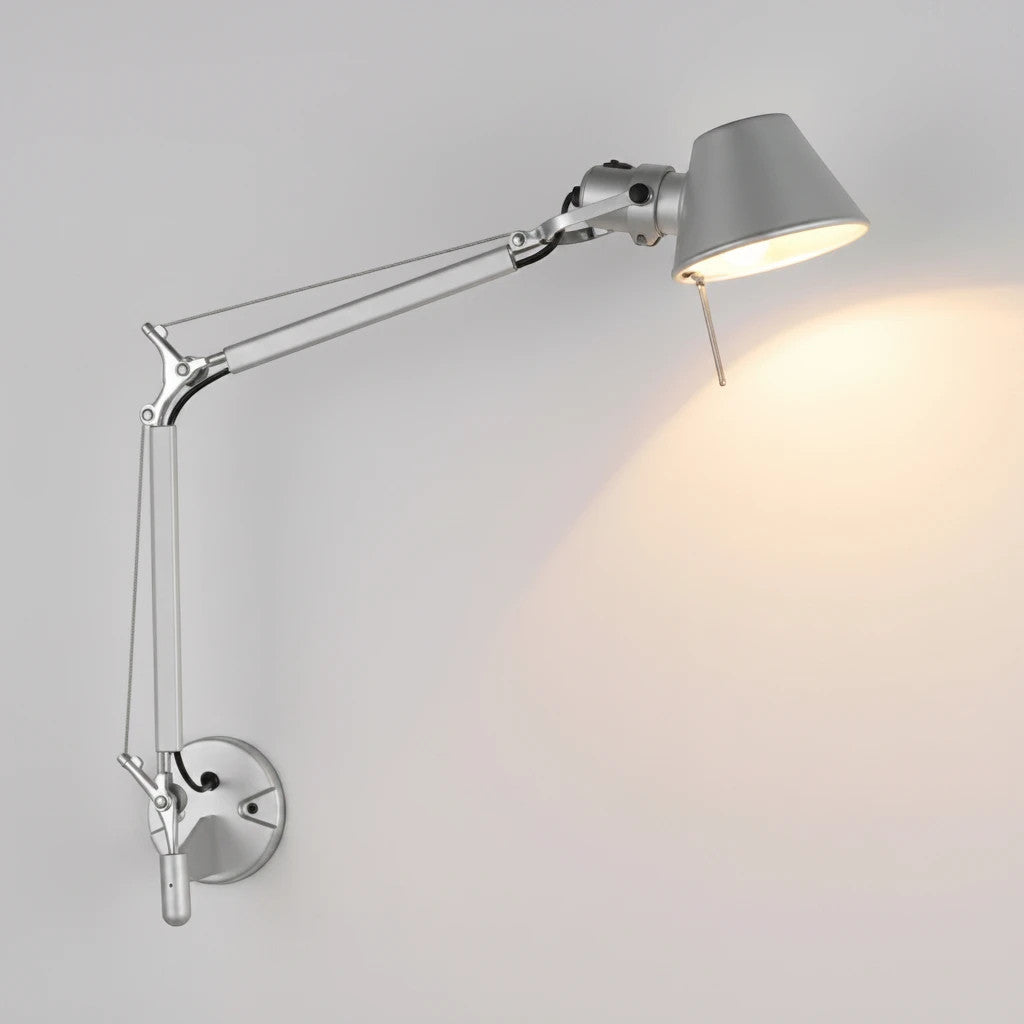 Lysverden silver metal wall lamp with adjustable swing arm and head for focused reading or task lighting.