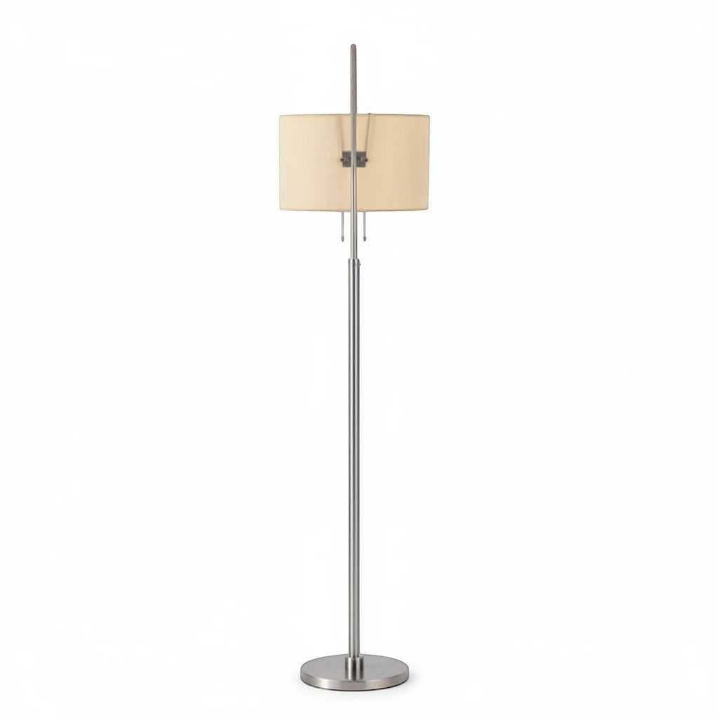 Lysverden floor lamp with a brushed silver metal stand and a beige fabric drum shade for warm ambient lighting
