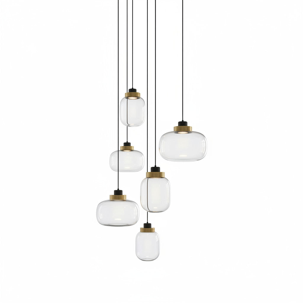 Lysverden cluster pendant light with smoke glass shades and brass accents hanging at varying heights